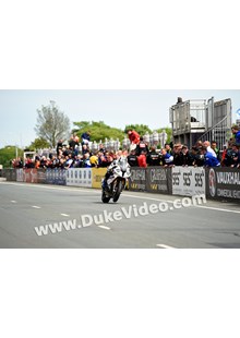 TT 2014 Michael Dunlop racing through Grandstand