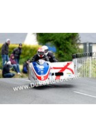 TT 2014 Conrad Harrison and Mike Aylott jumping at Ballaugh