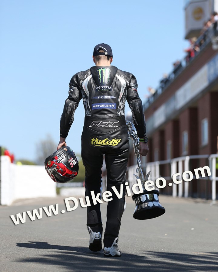 Ian Hutchinson with winners trophy TT 2015 - click to enlarge